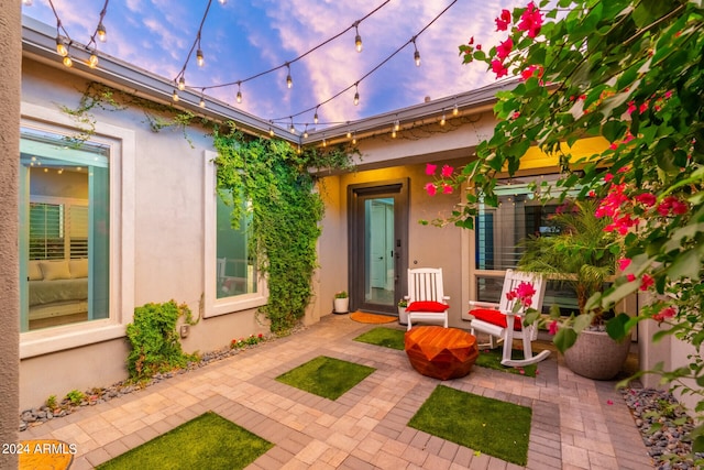 view of patio terrace at dusk