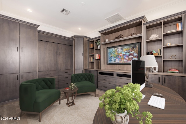 sitting room featuring crown molding