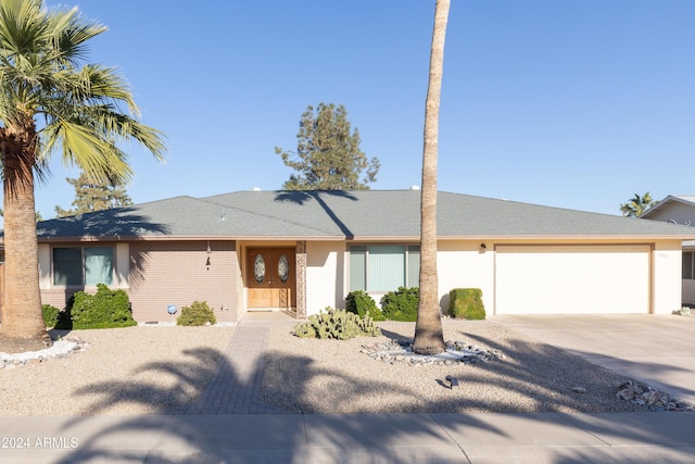 single story home with a garage