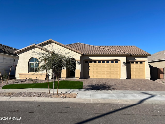 mediterranean / spanish house featuring a garage