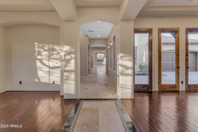 foyer featuring dark hardwood / wood-style flooring and french doors