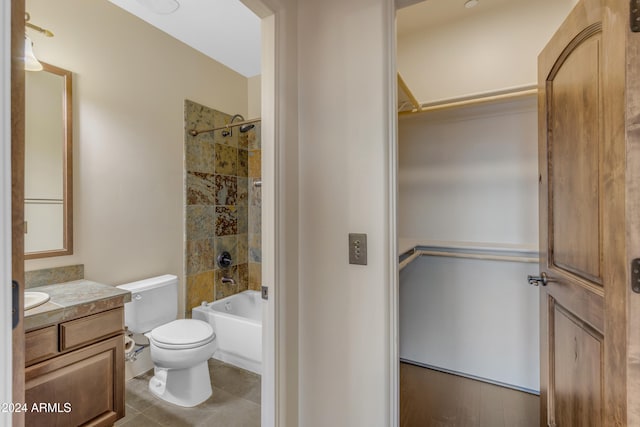 full bathroom with vanity, toilet, and tiled shower / bath