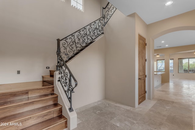 staircase with ceiling fan