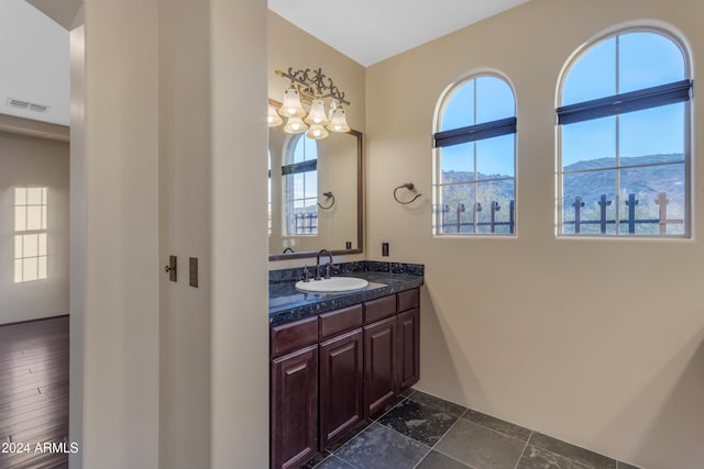 bathroom featuring a mountain view and vanity