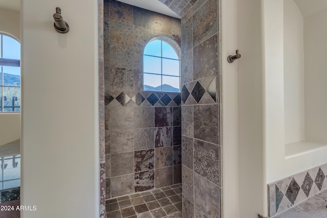 bathroom with a tile shower