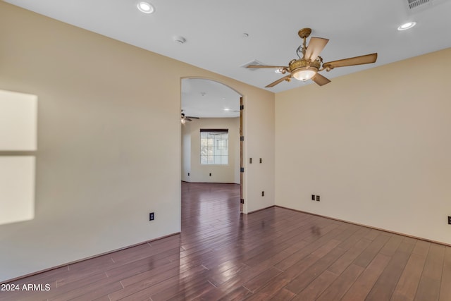 empty room with hardwood / wood-style flooring