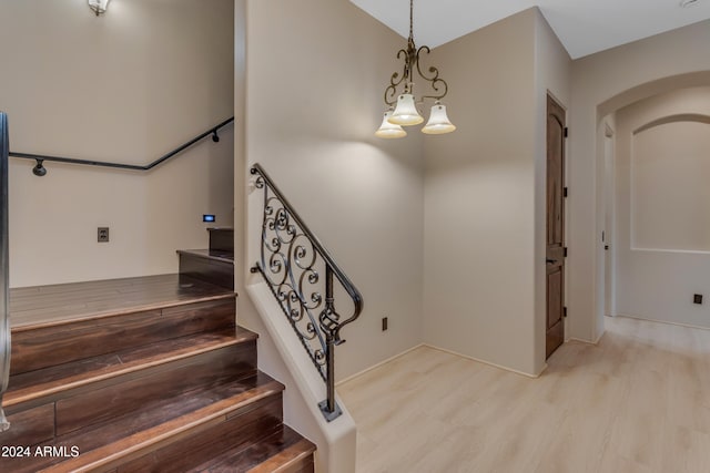 staircase featuring hardwood / wood-style floors