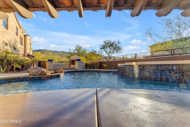 view of swimming pool with pool water feature