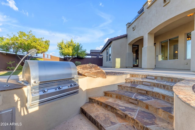 view of patio featuring an outdoor kitchen and area for grilling