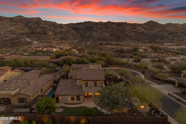 aerial view at dusk with a mountain view