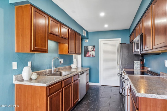 kitchen with sink and appliances with stainless steel finishes