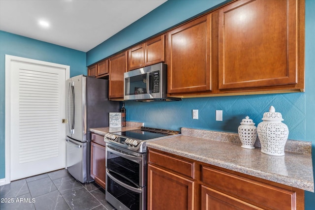 kitchen with stainless steel appliances and backsplash