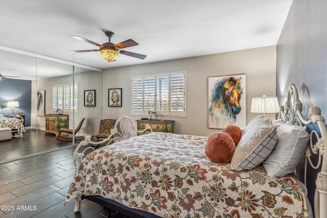 bedroom featuring ceiling fan and dark hardwood / wood-style flooring