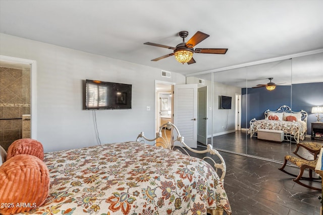 bedroom with ceiling fan, dark hardwood / wood-style flooring, and a closet