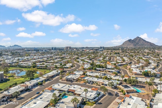 drone / aerial view with a water and mountain view