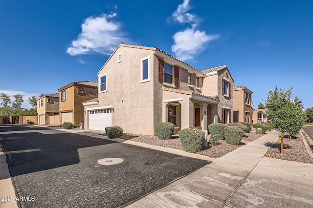 2862 E Megan St, Gilbert, AZ 85295 - view of property exterior featuring a tiled roof, a garage, a residential view, stucco siding, and driveway