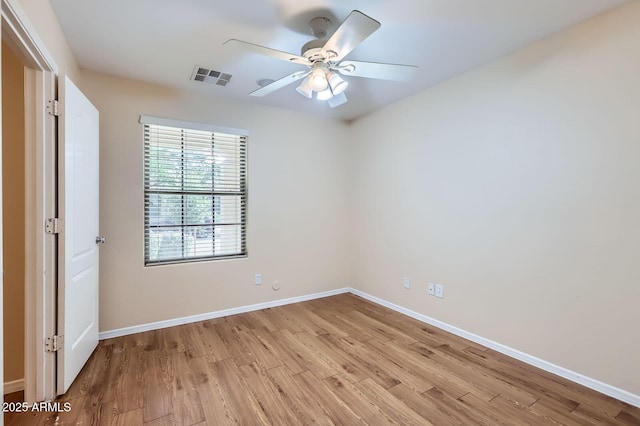 2862 E Megan St, Gilbert, AZ 85295 - spare room featuring light wood-style flooring, baseboards, and ceiling fan