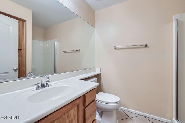 2862 E Megan St, Gilbert, AZ 85295 - full bath with vanity, tile patterned floors, toilet, a shower with door, and baseboards