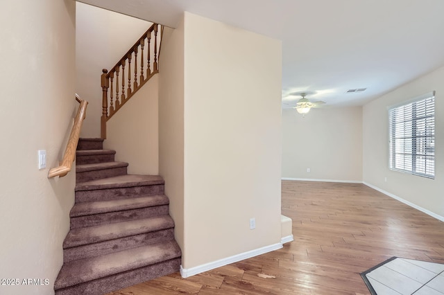 2862 E Megan St, Gilbert, AZ 85295 - stairs featuring ceiling fan, wood finished floors, and baseboards