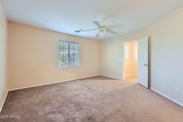 2862 E Megan St, Gilbert, AZ 85295 - carpeted empty room featuring healthy amount of natural light, ceiling fan, and baseboards