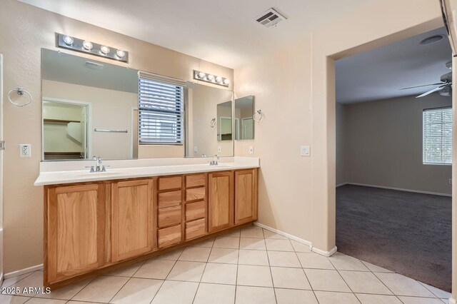 2862 E Megan St, Gilbert, AZ 85295 - bathroom featuring double vanity, ceiling fan, baseboards, and tile patterned floors