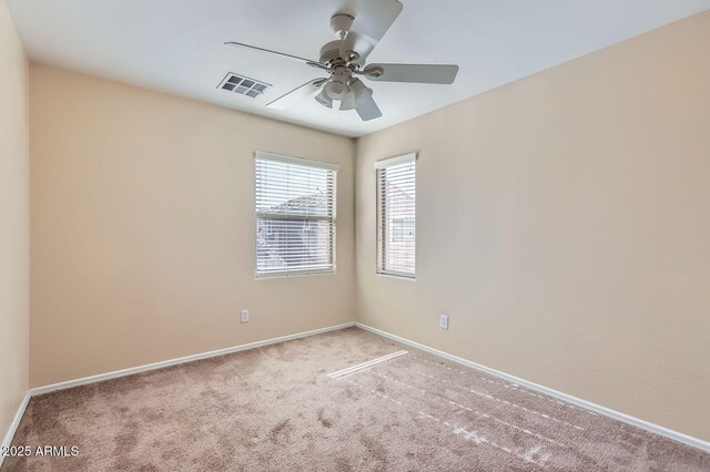 2862 E Megan St, Gilbert, AZ 85295 - unfurnished room featuring carpet, baseboards, and a ceiling fan