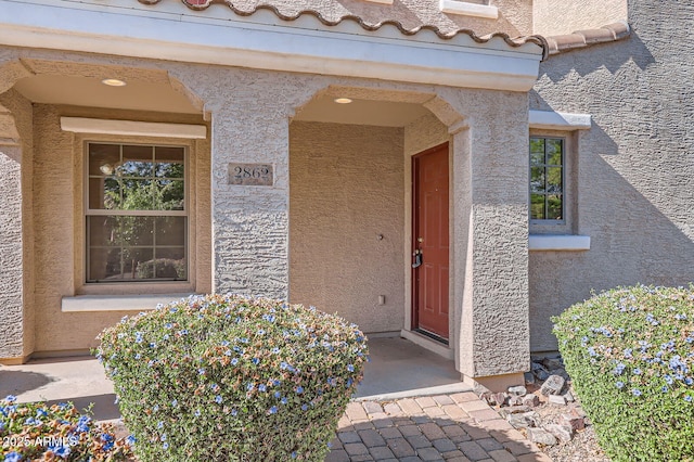 2862 E Megan St, Gilbert, AZ 85295 - doorway to property featuring stucco siding