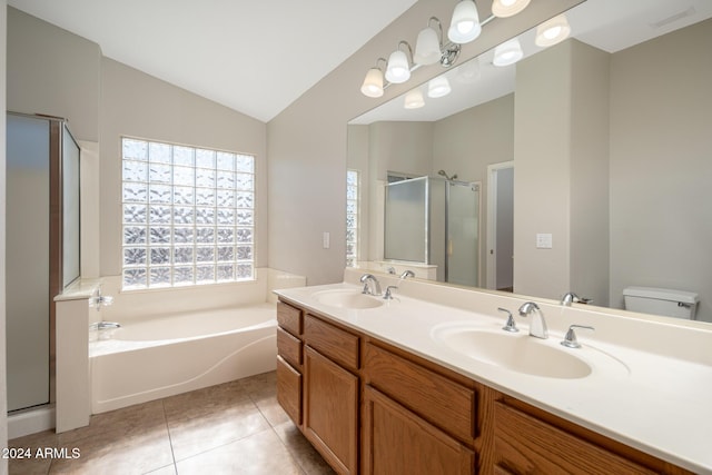 full bathroom featuring tile patterned flooring, vanity, separate shower and tub, and vaulted ceiling