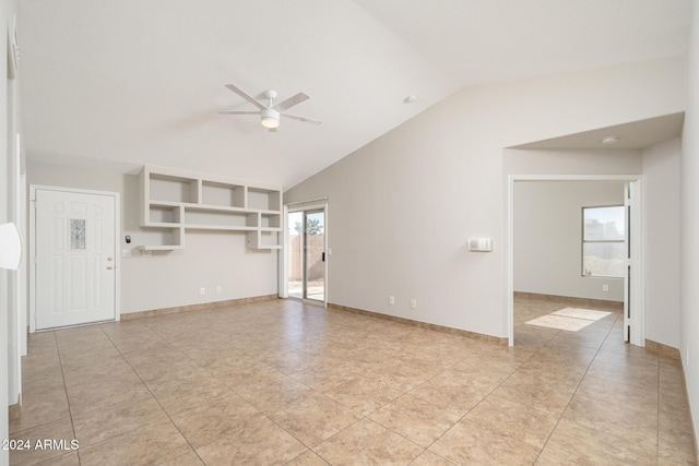 unfurnished living room featuring light tile patterned floors, a wealth of natural light, lofted ceiling, and ceiling fan