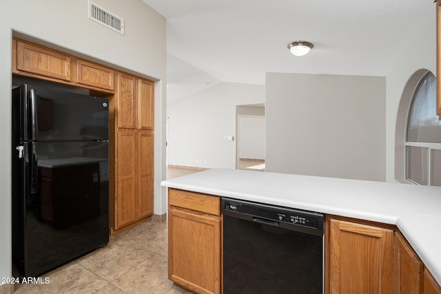 kitchen with black appliances, lofted ceiling, and light tile patterned floors