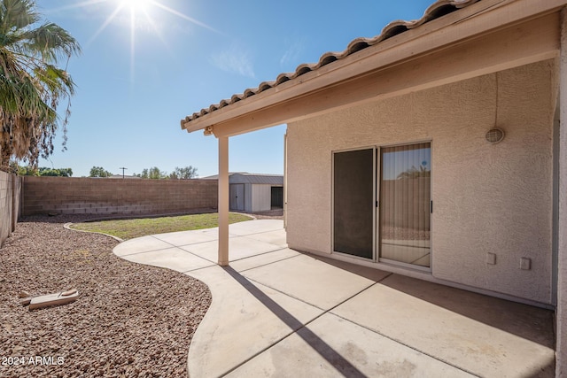 view of patio / terrace featuring a shed