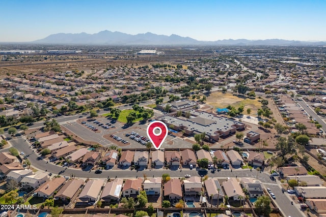 birds eye view of property with a mountain view