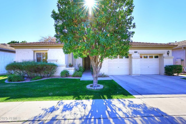 view of front of house with a front yard and a garage