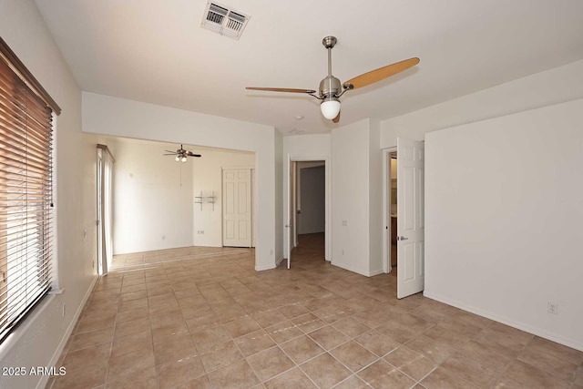 unfurnished room featuring ceiling fan