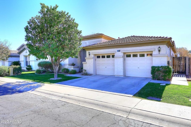 view of front of property featuring a front lawn and a garage