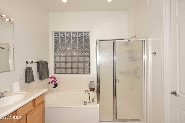 bathroom featuring separate shower and tub and vanity