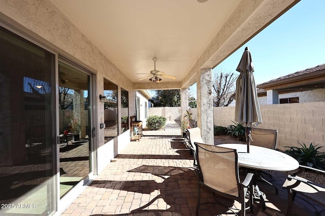 view of patio / terrace featuring ceiling fan