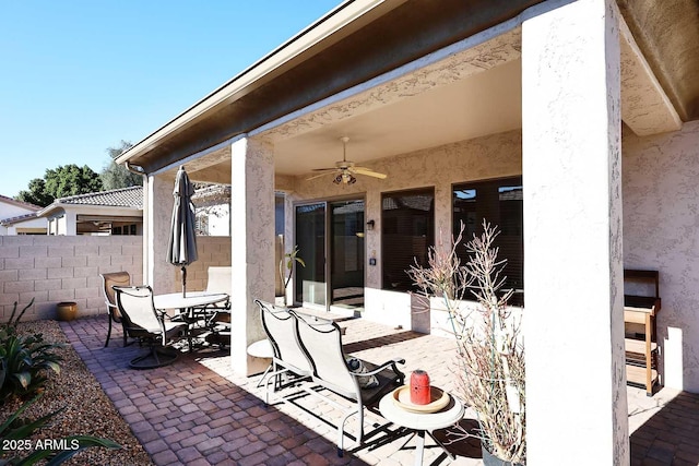 view of patio featuring ceiling fan