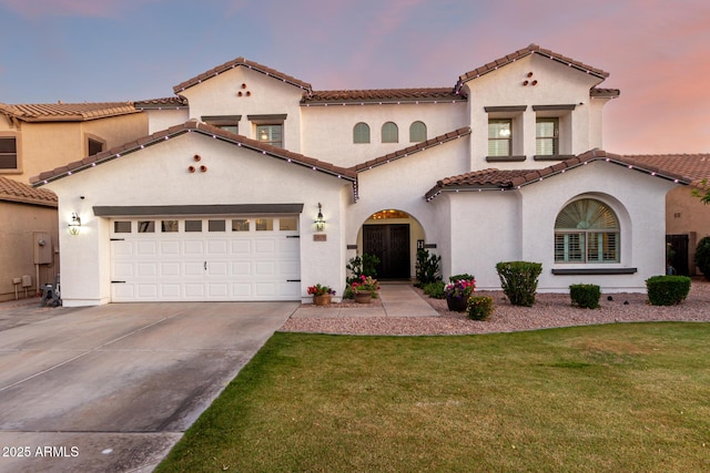 1429 E Lowell Ave, Gilbert, AZ 85295 - mediterranean / spanish house with concrete driveway, a front yard, a tiled roof, stucco siding, and an attached garage