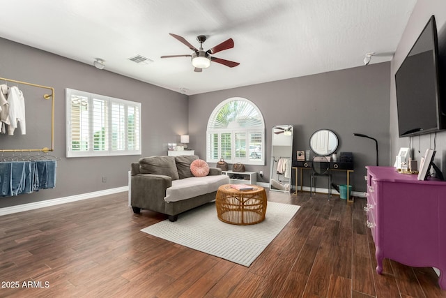 1429 E Lowell Ave, Gilbert, AZ 85295 - living area with a ceiling fan, dark wood-style floors, and baseboards