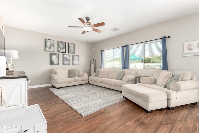 1429 E Lowell Ave, Gilbert, AZ 85295 - living room featuring a ceiling fan, dark wood-style flooring, and baseboards