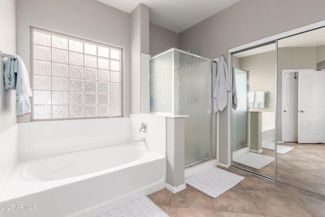 1429 E Lowell Ave, Gilbert, AZ 85295 - bathroom with healthy amount of natural light, a shower stall, a garden tub, and tile patterned flooring