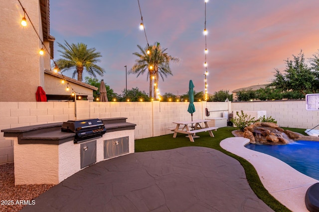 1429 E Lowell Ave, Gilbert, AZ 85295 - view of patio / terrace with grilling area, an outdoor kitchen, and a fenced backyard
