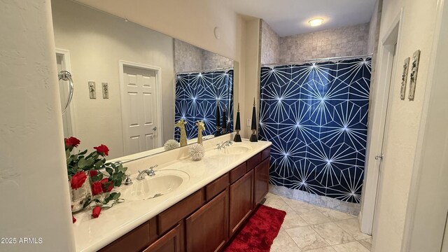 bathroom featuring vanity, tile patterned floors, and a shower