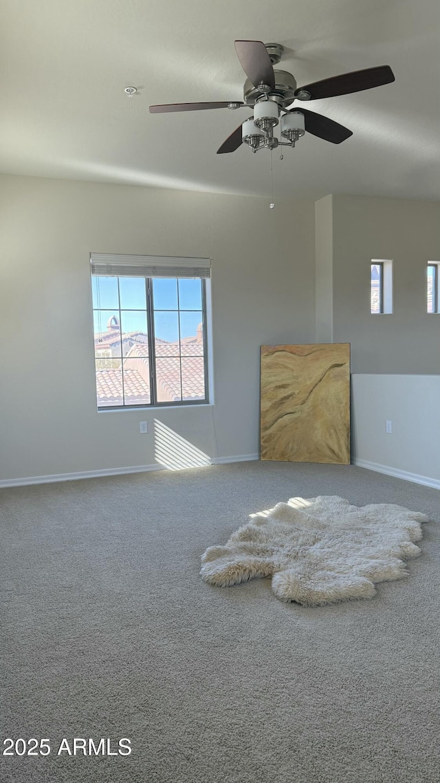 unfurnished living room featuring carpet flooring