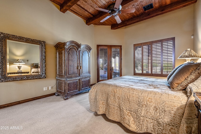 bedroom featuring french doors, wood ceiling, ceiling fan, beamed ceiling, and light colored carpet