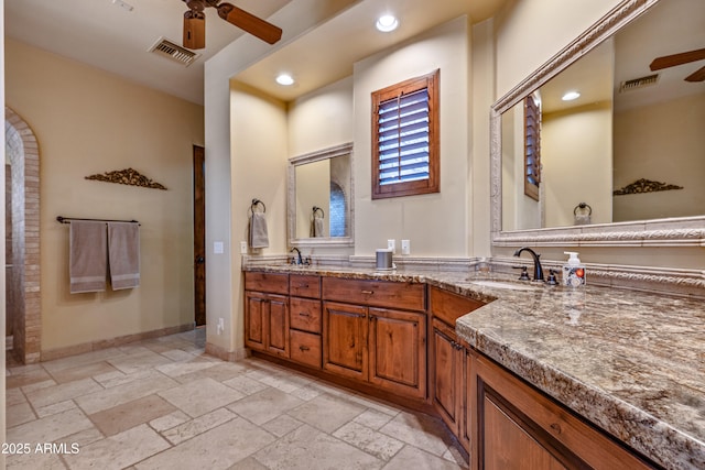 bathroom featuring vanity and ceiling fan