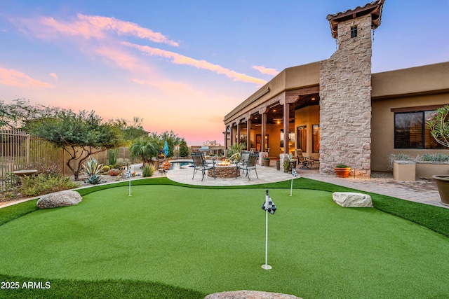 exterior space with a patio and a fire pit