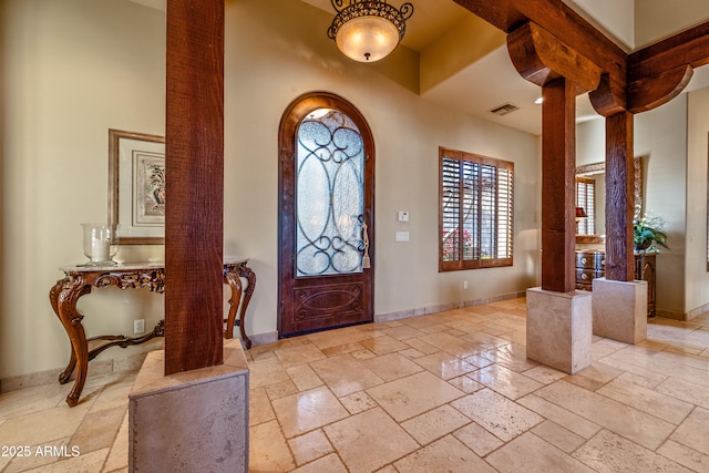 entrance foyer featuring decorative columns