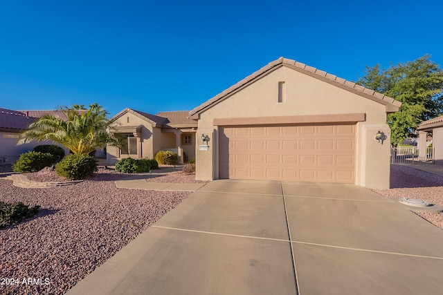 single story home with a garage